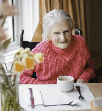 Resident enjoying a cup of tea